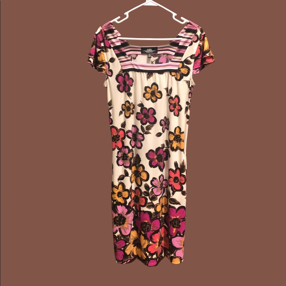 B. Moss size medium cream dress with bright floral design